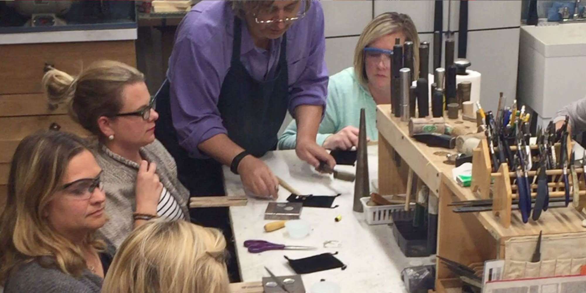 Levent Oz teaching new silversmith students